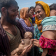 In this Sept. 14, 2017, file photo, Rohingya Muslim man Naseer Ud Din holds his infant son Abdul Masood, who drowned when the boat they were traveling in capsized just before reaching the shore. His wife, Hanida Begum, cries upon reaching the Bay of Bengal shore in Bangladesh. Myanmar, a predominantly Buddhist nation of 60 million, has sent more than 850,000 of the country’s 1.3 million Rohingya fleeing. This is one of the winning photos in the Associated Press Media Editors contest. See item, third below Ana DuVernay. (Credit: AP Photo/Dar Yasin, file)